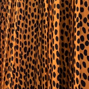 JCrew burnt orange with deep navy dots, pleated skirt.